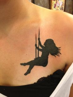 a woman with a tattoo on her chest is holding a pole in the shape of a girl