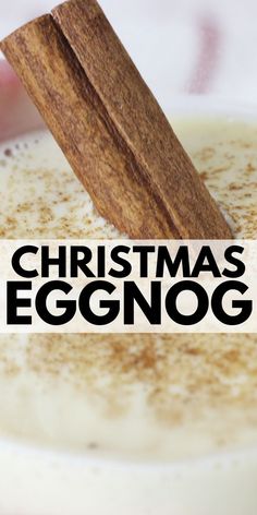 a cup of eggnog with cinnamon stick sticking out of it's top