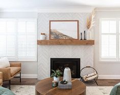 a living room filled with furniture and a fire place in front of a tv mounted on a wall