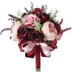 a bridal bouquet with roses and greenery on it's side, tied in red ribbon