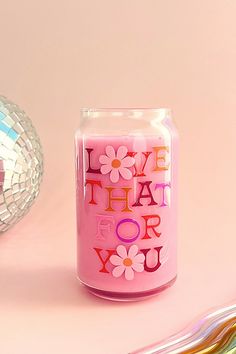 a pink candle sitting on top of a table