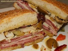 a cut in half sandwich sitting on top of a white plate