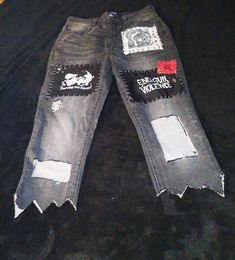 Awesome modified thrifted pants, all decked out!  Pants are cropped, with pointed edges, peekaboo gaps in thighs, and a variety of protest patches. Tag size 11. Distressed Straight Leg Pants For Alternative Fashion, Distressed Punk Pants For Alternative Fashion, Punk Style Distressed Pants For Alternative Fashion, Alternative Style Ripped Bottoms For Streetwear, Alternative Ripped Bottoms For Streetwear, Grunge Straight Leg Bottoms For Alternative Fashion, Alternative Style Distressed Straight Leg Pants, Punk Straight Leg Bottoms For Alternative Fashion, Distressed Emo Bottoms For Streetwear