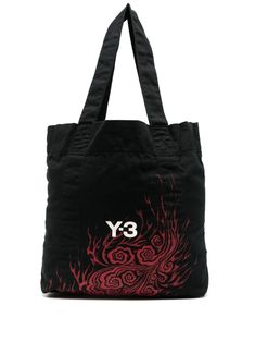 Shop Y-3 graphic-print tote bag Black Graphic Print Bags For Streetwear, Black Graphic Print Bag For Streetwear, Black Bags With Graphic Print For Streetwear, Black Bags With Logo Patch For Daily Use, Black Streetwear Bag With Logo Patch, Everyday Black Bags With Logo Patch, Black Everyday Bags With Logo Patch, Daily Use Tote Shoulder Bag With Logo Patch, Cotton Tote Shoulder Bag With Logo Print