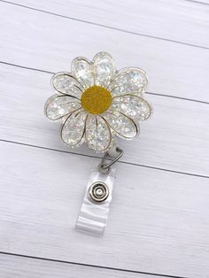 "This cute flower badge reel can be changed out with different toppers to fit each holiday or mood. It is the perfect addition to add a bit of sparkle to your badge reel.  This also makes a great gift for healthcare workers, education staff and anyone else that has to wear a badge. DETAILS: -2\" badge -Topper can be attached permanently or interchangeable using Dual Lock Velcro.  This ensures that it is sturdy while also easy to clean (especially for our healthcare workers!) -Hand glittered and sealed with resin for added protection against wear and tear while also giving it a smooth finish. -34\" retractable badge reel -This is a handmade item and is made to order.  No two items will be exactly the same. Interchangeable badge reels: On these badge reels, the topper is secured to the badge Diy Nurse Badge Reel, Zindee Badge Reels, How To Make Badge Reels, Resin Badge Reel Diy, Badge Reel Ideas, Nurse Crafts, Resin Badge Reel, Badge Reels Diy, 30th Birthday Themes