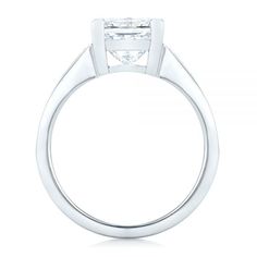 102536 14k White Gold Ring   16 Diamonds - .96 ctw   Clarity: VS2 - Color: F-G    Joseph Jewelry. This stunning engagement ring features a princess cut diamond channel set in white gold, with baguette diamond accents on the shank shoulders. It was created for a couple from Bellingham, WA, who worked with our team both online and in person in our Bellevue, WA showroom to ensure we fully captured their vision for the piece. Design Your Own Engagement Ring      Center Setting      The diamond at th White Princess Cut Diamond Ring In Platinum, White Platinum Diamond Ring Princess Cut, Princess Cut Diamond Ring With Tension Setting, White Platinum Princess Cut Wedding Ring, Promise Diamond Ring Princess Cut Channel Set, Princess Cut Diamond Ring Channel Set For Promise, Princess Cut Channel Set Diamond Promise Ring, Platinum Diamond Ring Princess Cut Channel Set, White Princess Cut Wedding Rings With Tension Setting