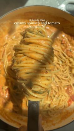 someone is stirring some pasta in a pot