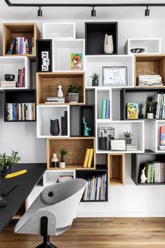 an office with bookshelves, desk and chair