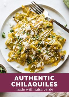 a white plate topped with pasta covered in cheese