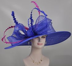 "The crown is decorated with 100%  feathers and  big sinamay bow. Very beautiful!! Head girth is 21\"-23.225 \", it is a super wide brim hat, this is the widest brim style hat in my store, from left to right is 26\"around.  For the base hat, 10 colors available, for the decoration feathers, 18 colors available. If you want to choose  the colors to match your dress, please check the pictures from fifth to eighth and feel free to contact me, I will help you. This is a gorgeous, very beautiful hat. Blue Hat With Feather Trim For Weddings, Blue Hats With Feather Trim For Weddings, Blue Sinamay Hat For Party, Blue Feather Trim Hat For Kentucky Derby, Blue Feather Trim Hat For Races, Blue Feather Trim Mini Hat For Kentucky Derby, Blue Mini Hat With Feather Trim For Kentucky Derby, Blue Feathered Hat For Races, Elegant Blue Costume Hats And Headpieces With Feather Trim