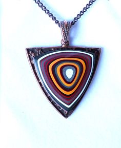 "20\" Fordite Detroit Agate on Copper Sheild and Chain Pendant is 1.75\" long including the bail  Comes in a leatherette gift box" Unique Brown Jewelry With Adjustable Chain, Collectible Brown Pendant Necklace, Fordite Ring, Fordite Detroit Agate, Orange Agate Pendant Jewelry, Blue Agate Pendant Jewelry, Luxury Agate Pendant Gemstone, Chain Pendants, Agate