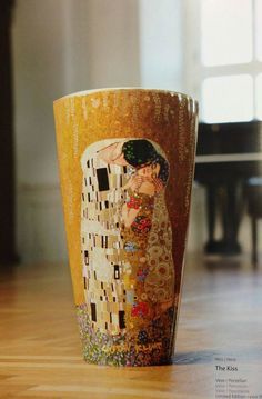 a coffee cup with an image of a woman hugging a man's face on it