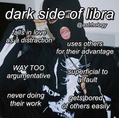 a person wearing a black mask with the words dark side of libra on it