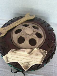 a cake with a movie reel on it and two pieces of paper next to it