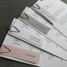 five different types of name tags on top of each other, one for the bride and one for the groom