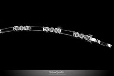 Drina Triplet Round Cut 5ct Cubic Zirconia Tennis Bracelet This 5 Carat Triplet Round Cut Fashion Bracelet is created with best quality Round Cut Cubic Zirconia in Prong Setting Polished into a Lustrous Silvertone Rhodium Finish. This art deco fashion piece is perfect for pairing with your daily attire. This is a Great Travel Piece, which gives the appeal of a diamond bracelet, without the worry of miss placing it at a Hotel. All Cubic Zirconia shines a lot like diamond. Item: BSJ-SB101065R01-6. Classic Diamond Crystal Bracelet For Wedding, Classic Cubic Zirconia Crystal Bracelet For Wedding, Wedding Crystal Tennis Bracelet With Brilliant Cut, Elegant Wedding Crystal Bracelet With Brilliant Cut, Classic Diamond White Crystal Bracelet For Wedding, Wedding Crystal Bracelet In Diamond White With Brilliant Cut, Diamond White Brilliant Cut Crystal Bracelet For Wedding, Adjustable Wedding Tennis Bracelet With Prong Setting, Adjustable Tennis Bracelet With Prong Setting For Wedding