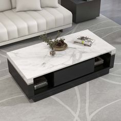 a marble coffee table sitting on top of a carpeted floor next to a couch