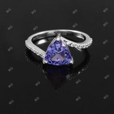 Tanzanite Ring, Genuine Tanzanite Diamond Ring, Trillion Ring, Sterling Silver December Birthstone Ring ,Wedding Engagement Bridal Ring Gift Specification: Stone Name- Tanzanite Stone Creation - Lab Grown Stone Size - 8 mm Stone Shape - Trillion Shape Stone Cut - Faceted Stone Color- blue Accent Stone - Moissanite Size - 2 mm Shape - Round Color - Whiteg Metal- 925 Sterling Silver Finished With Rhodium Method- Cast Personalization- Possible Occasion- Engagement Stone Style- Two Stone Band Ring S Violet Engagement Ring, Trillion Cut Engagement Ring, Trillion Ring, December Birthstone Ring, Tanzanite Diamond Ring, Tanzanite Stone, Blue Accent, Tanzanite Diamond, Tanzanite Ring