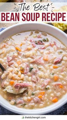 the best bean soup recipe with ham and beans in a white bowl on top of a blue napkin