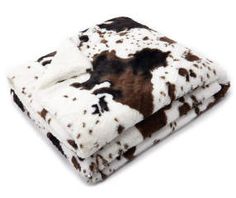 a blanket with brown and white spots on it