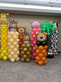 there are many balloons in the shape of animals