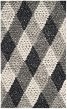 a black and white rug with squares on it