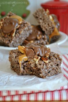 two pieces of chocolate peanut butter granola bars on a plate