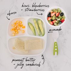 a white plate topped with fruit and veggies next to a bowl of salad