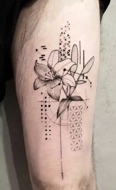 a black and white flower tattoo on the leg