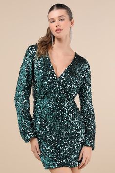 You'll leave everyone instantly impressed by your stunning ways in the Lulus Indescribable Shine Teal Green Sequin Long Sleeve Mini Dress! An array of shimmering teal sequins dance across a mesh overlay as it shapes a lightly gathered bodice with a flirty surplice neckline and long sleeves (with elastic at the cuffs). The fitted, elasticized waist tops a bodycon skirt that finishes at a cute mini hem. Fit: This garment fits true to size. Length: Mid-thigh. Size medium measures 30" from shoulder Mini Dress Sequin, Short Green Dress, Casual Formal Dresses, Gathered Bodice, Lulu Fashion, Dress Sequin, Bodycon Skirt, Casual Wedding Dress, Green Sequins