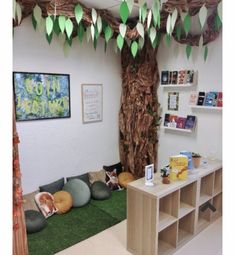 an office decorated with paper leaves and cat beds