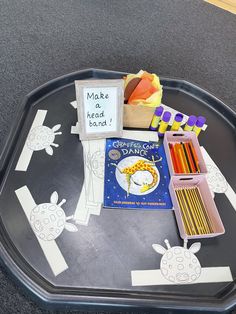 a tray that has some writing and crafts on it