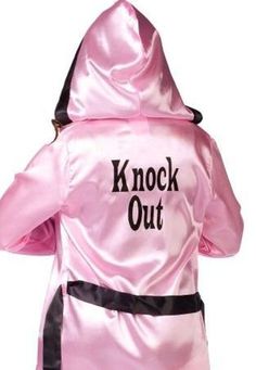 a pink jacket with the words knock out on it's back and black lettering