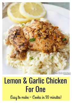 lemon and garlic chicken for one on a white plate with rice and lemons in the background