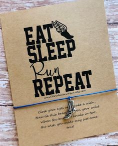 a bracelet that says eat sleep run repeat