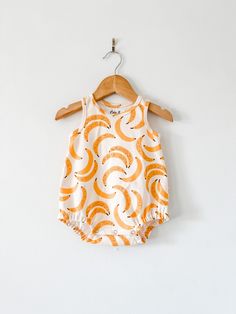 Your little will look super rad while staying cool in this bubble romper! So perfect for layering in cooler weather, and on it's own for hot summer days! This romper is sewn up in a super cute banana print. This stylish bodysuit features cotton produced in the USA that is certified organic by global organic textile standards so you can feel good about dressing your baby in it! We serge all seams for added durability and strength. We include snaps for easy dressing and diapering. Here is our size Modern Baby Clothes, Cute Banana, Romper Summer, Organic Kids Clothes, Combi Short, Banana Print, Summer Baby Clothes, Baby Colors