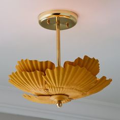 a chandelier hanging from the ceiling in a room