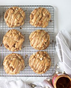 six cookies on a cooling rack with peanut butter