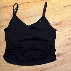 Nwot Free People Good Karma Ruched Crop Tank In Black Xs An Ultra-Flattering Active Crop That Transitions To Brunch, Bikram And Beyond With A Scooped Neckline And Ultra-Flattering Ruched Details To Accentuate Your Shape. Fit: Longline Silhouette, Pull-On Style, Cropped Features: Buttery Soft Fabrication With A Stretchy Feel, Scoop Neckline, Flattering Ruched Detailing, Built-In Shelf Bra, Entry-Level Compression, Spf 30 Uv Protection Why We It: This Sleek Tank Is A Versatile Activewear Essential Casual Black Ruched Tank Top, Black Scoop Neck Bra-friendly Crop Top, Black Fitted Moisture-wicking Tank Top, Versatile Black Moisture-wicking Tank Top, Compressive Moisture-wicking Black Tank Top, Black Compressive Moisture-wicking Tank Top, Good Karma, Scooped Neckline, Fp Movement