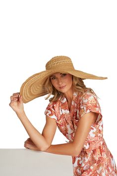 The perfect floppy hat for all your sunny endeavors! Woven straw shapes this perfect sun hat with a rounded top and a wide, wired-enforced floppy brim. Internal drawstring grosgrain ribbon. Since brim is wired, can be shaped exactly to your liking! 8” Soft brim. 21.25" interior circumference with internal drawstring. Crown measures 4.5” tall. 75% Paper, 25% Polyester. Spot Clean. Brimmed Sun Hat For Garden Party Vacation, Curved Brim Hat For Garden Party Vacation, Curved Brim Hat For Garden Party And Vacation, Curved Brim Sun Hat For Vacation, Wide Brim Hats For Garden Party Vacation, Casual Wide Brim Panama Hat For Garden Party, Casual Straw Sun Hat For Garden Party, Wide Brim Straw Hat For Warm Weather, Vacation Sun Hat With Curved Brim