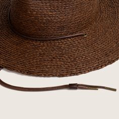 Our much loved, best selling Austin is back with an updated straw weave! From the desert to the sea, Austin Brown is hand braided from natural raffia straw. Designed to get you from dusty roads to salty seas and everywhere in between. The wide brim ensures sun protection and the chin strap will keep your hat on your head for every adventure. Brown Woven Straw Fedora, Adjustable Coastal Straw Hat Made Of Toquilla, Brown Braided Panama Hat With Curved Brim, Brown Woven Straw Hat Bands, Brown Straw Hat For Travel, Adjustable Brown Handwoven Panama Hat, Adjustable Handwoven Brown Panama Hat, Flat Brim Braided Straw Hat, Rustic Straw Sun Hat With Flat Brim