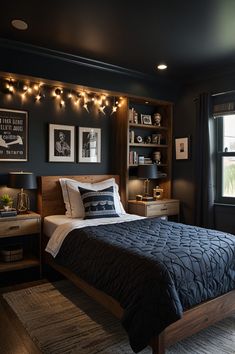 a bed room with a neatly made bed and some lights on the wall above it