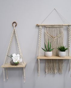 two macrame shelves with plants on them