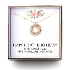 a birthday card with an image of a necklace in a box that says happy 50th, five rings for five fabulous decades