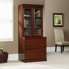 a tall wooden cabinet sitting in the middle of a living room next to a window