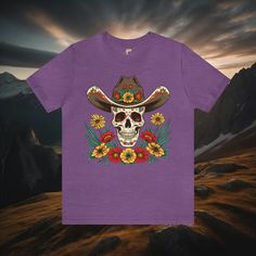 Saddle up and get ready to ride in our Cowboy Skull and Wildflowers Unisex Tee. This jersey short sleeve tee features a striking cowboy skull surrounded by vibrant wildflowers, paying homage to folk art design. Perfect for any cowgirl or cowboy, this tee seamlessly combines unique style with comfort, making it a must-have addition to your wardrobe. Giddy up and add a touch of Western flair to your look today. #15 Folk Art Classic unisex jersey short sleeve tee fits like a well-loved favorite. So Cowboy Skull, Folk Art Design, Skull Tee, The Wild West, Western Chic, Arte Popular, Prism Color, Wild West, Irritated Skin