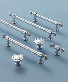 six chrome - plated handles and knobs are shown in this image with blue background