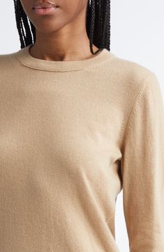 Ultrasoft cashmere yarns give luxurious softness to this classic sweater with ribbed trim. 22" length (size Medium) Crewneck Long sleeves 100% cashmere Dry clean or hand wash, dry flat Imported Classic Cashmere Cream Top, Beige Cashmere Top With Ribbed Collar, Beige Cashmere Tops With Ribbed Collar, Classic Beige Cashmere Tops, Beige Fine Knit Cashmere Sweater, Fine Knit Beige Cashmere Sweater, Classic Brown Cashmere Top, Cashmere Yarn, Classic Sweater