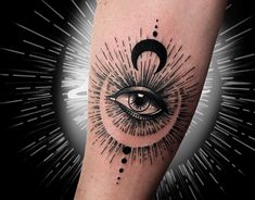 an all seeing eye tattoo on the arm