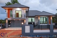 a two story house with an attached balcony